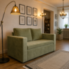 Parker green sofa cum bed styled in a modern living room