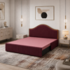 Blush maroon diwan sofa set in Rohini styled as a daybed with pink bolster cushions and gold trim headboard