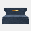 Zane Diwan Cum Bed in navy-blue patterned upholstery with a distinctive headboard and gold accent