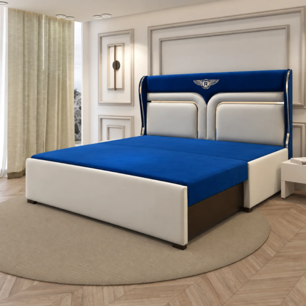 Skye Diwan Cum Bed in royal blue and white upholstery viewed from the front at an angle, highlighting its padded base, decorative headboard, and metallic side accents.