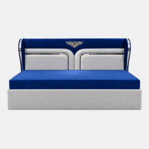 Skye Diwan Cum Bed with royal-blue and white upholstery, metallic silver accents, and a stylish headboard featuring a decorative emblem.