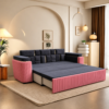 Rex pink and charcoal-grey sofa cum bed converted into a bed, showing its extended sleeping surface and channel-tufted pink front panel.