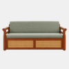 Arix Sofa Cum Bed with a walnut-brown wooden frame, sage-green cushions, and cane-weave front panels