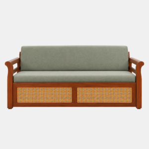 Arix Sofa Cum Bed with a walnut-brown wooden frame, sage-green cushions, and cane-weave front panels
