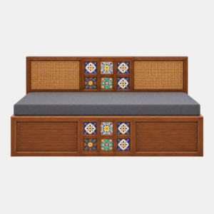 Front view of the Crest Diwan Cum Bed featuring a warm brown wooden frame, decorative cane panels, colourful tile accents, and a grey mattress against a white background.