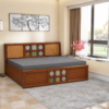 Crest Diwan Cum Bed arranged as a seating area in a bright living room with a window, grey rug, and wall art.