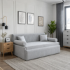 Cleo grey sofa cum bed styled in a modern living room with wooden furniture, neutral decor, and a vertically channelled backrest.