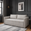 Ellis beige patterned sofa cum bed styled in a modern living room with dark walls and framed artwork.