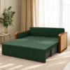 Grov green sofa cum bed converted into a bed with an extended sleeping surface