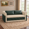 Baxter sofa cum bed with green and cream upholstery displayed in an elegant living room.